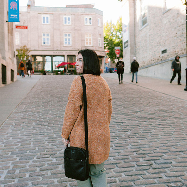 Brooke-lyn Cacciotti of Barrydowne Paint in Sudbury, Ontario, walking through a street in Old Montreal, Quebec.