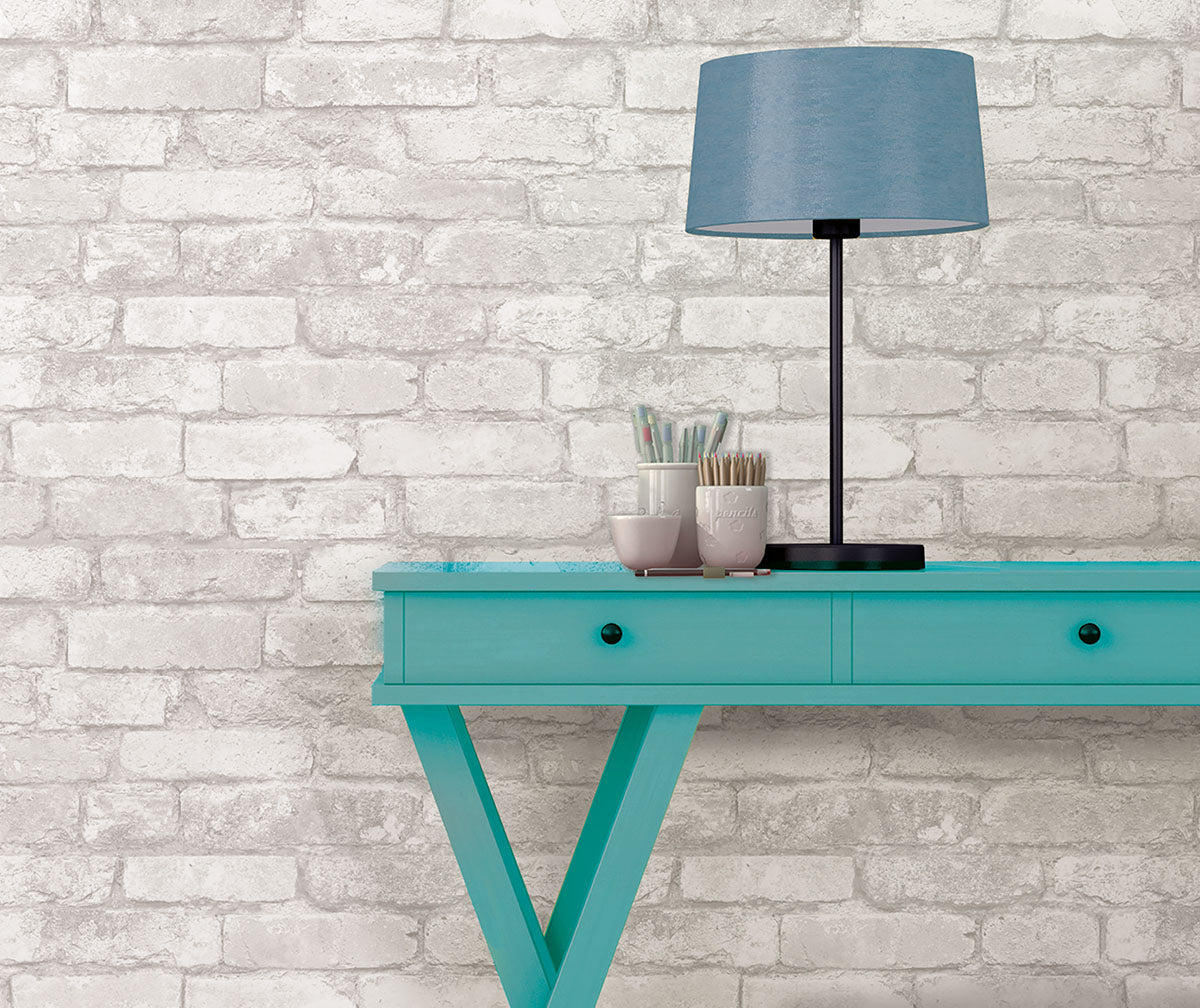 This faux brick wallpaper makes a neutral back drop which accentuates bold furniture!